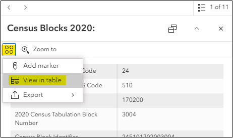 A pop-up for a Census block feature with the actions button highlighted and the option to view in table highlighted.